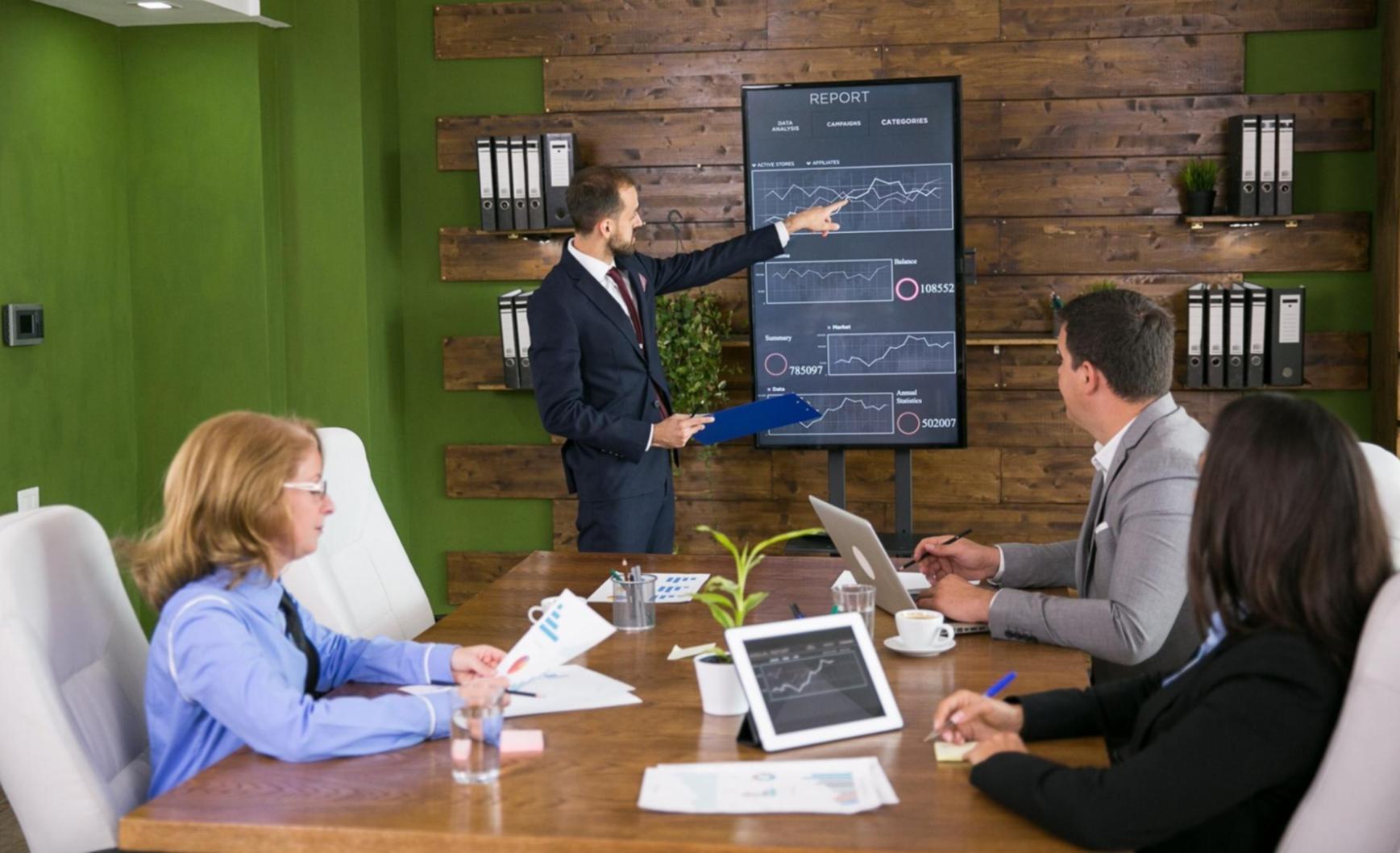 Financial reports and business performance metrics being reviewed